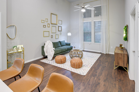 a living room with a couch and chairs and a table